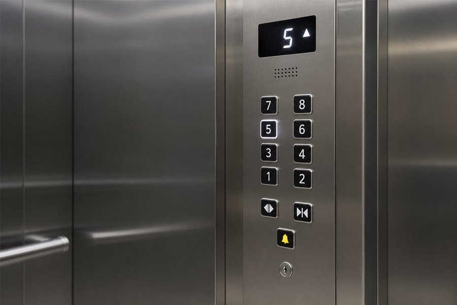 push button elevator cop, mechanical push button cop, and elevator cop with push buttons inside a modern elevator cabin